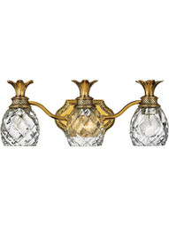 Pineapple Triple Bath Sconce With Clear Optic Glass in Burnished Brass.